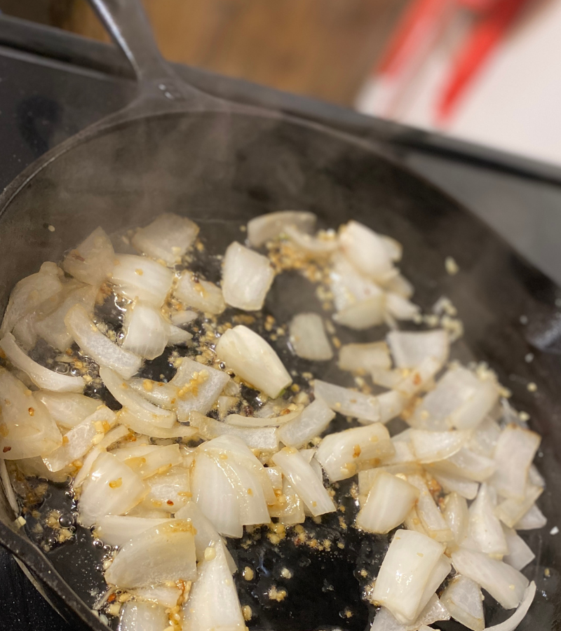 onions and garlic sauteeing in skillet