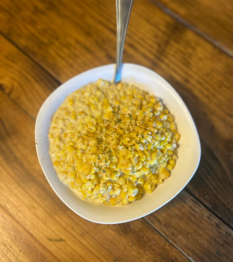 creamed corn in a white bowl