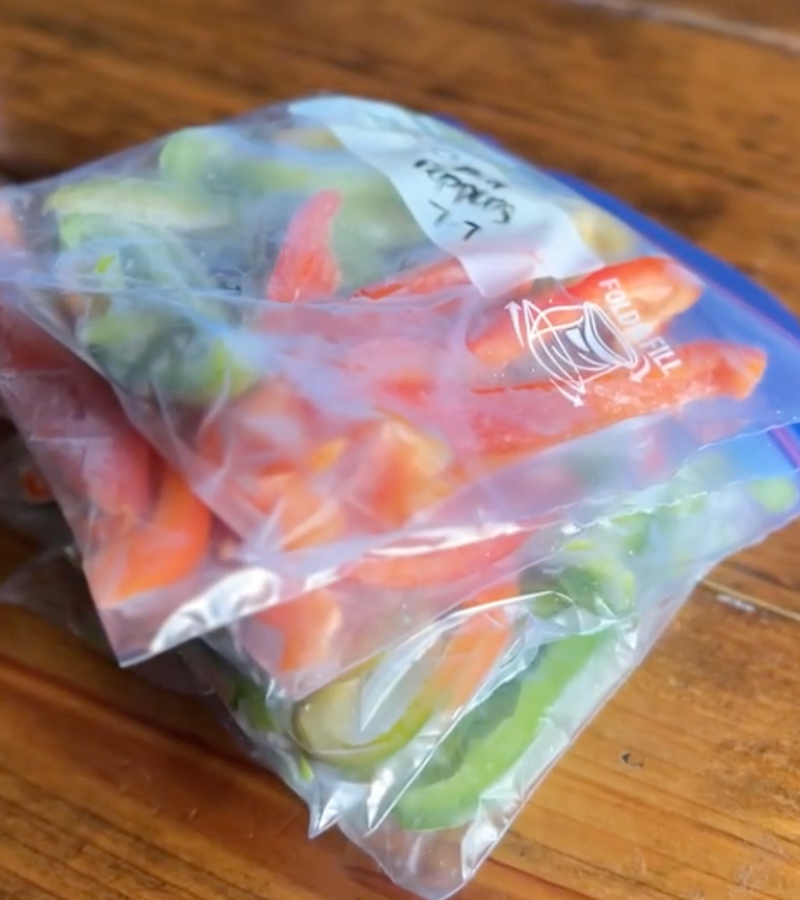 frozen bell pepper slices in freezer bags on table | How to Preserve Bell Peppers